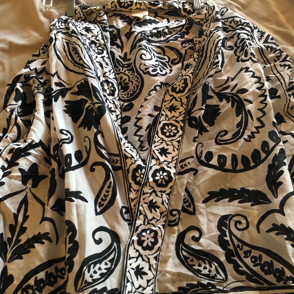 Wrap open front . Use over tank or swimsuit